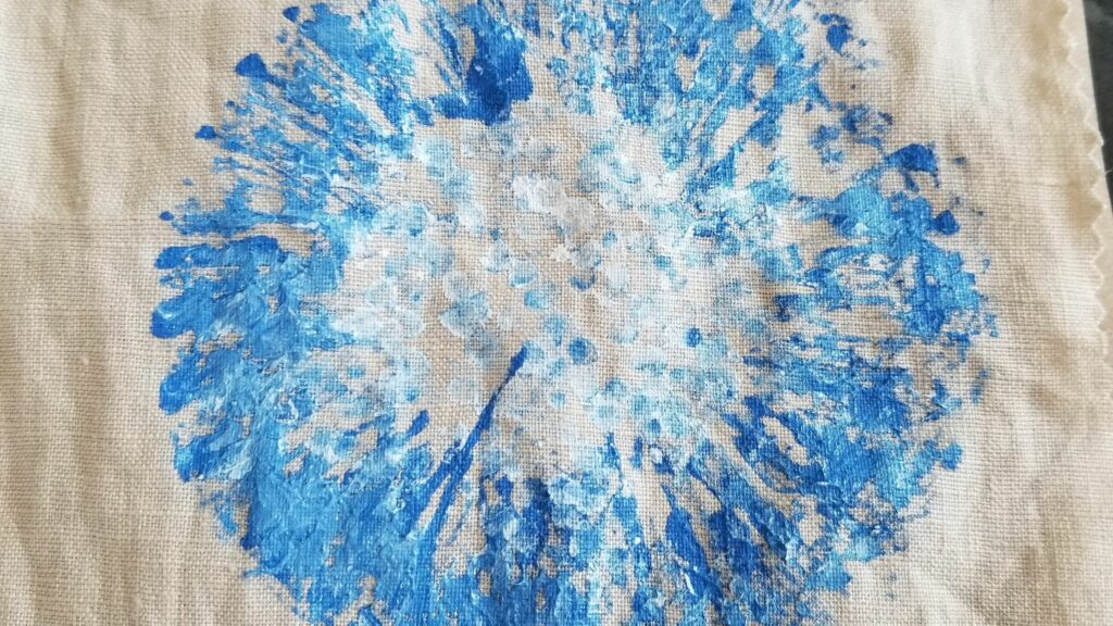 Close up of a blue and white dandelion.