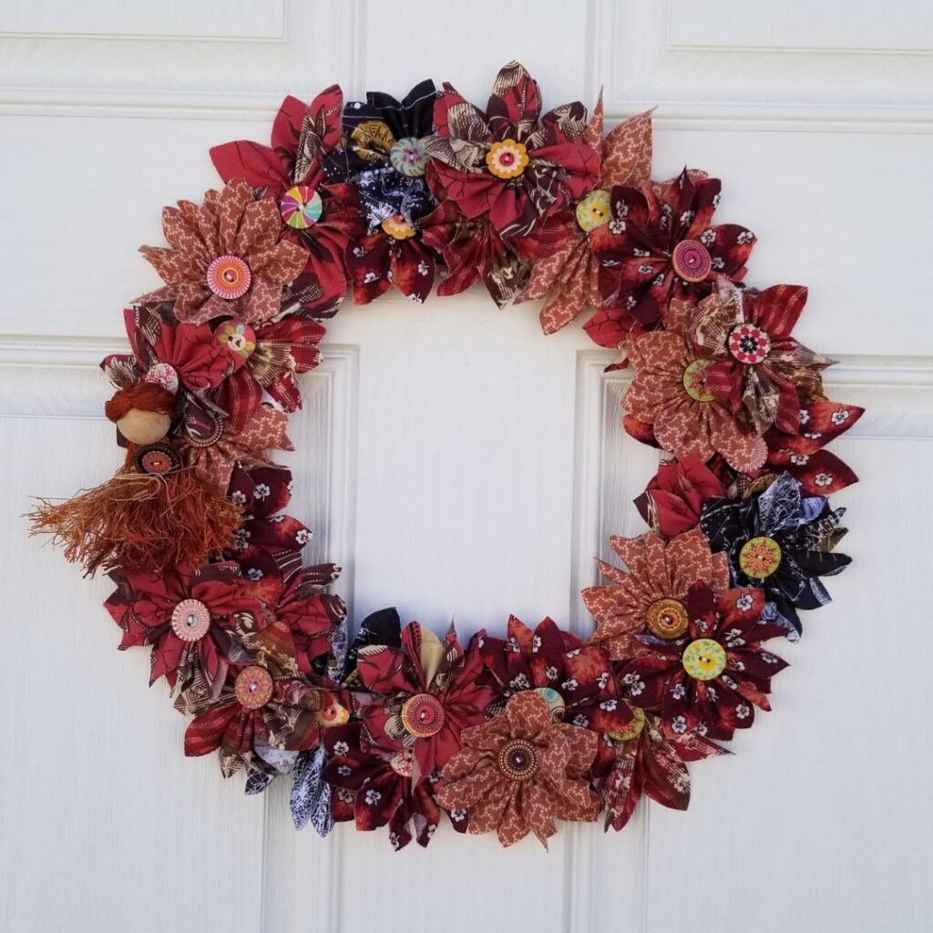 Completed flower wreath hanging on the door.